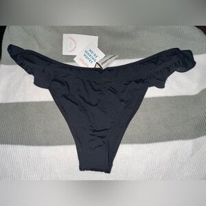 dippin daisys size large black bikini bottems with ruffle on sides